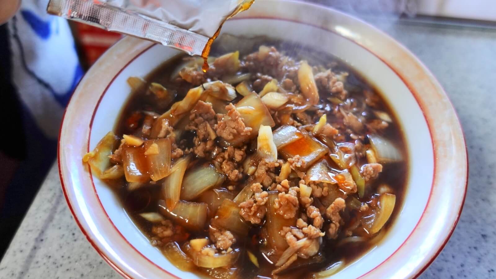 Katsuura Tantan Noodles Ezawa Recipe Add chili oil to a bowl